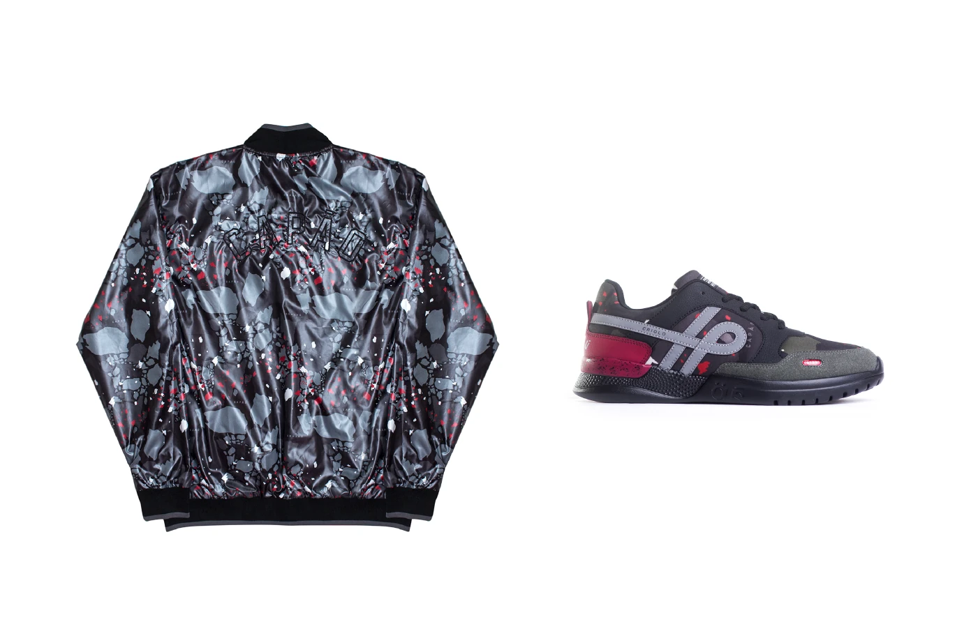 A printed bomber jacket beside a grey and burgundy sneaker on white.