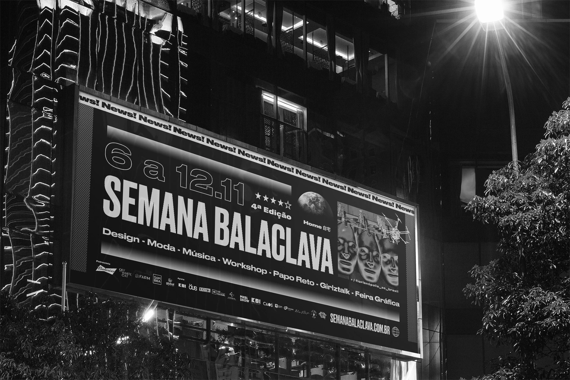 A large illuminated Semana Balaclava billboard on a building facade at night.